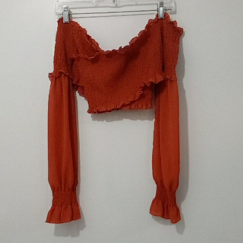 Cropped smocked orange long sleeve top